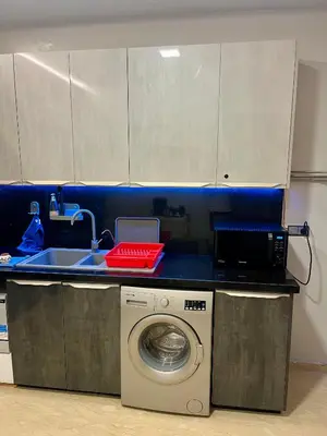 a kitchen with a washing machine and a sink at Sea view apartment in Casablanca