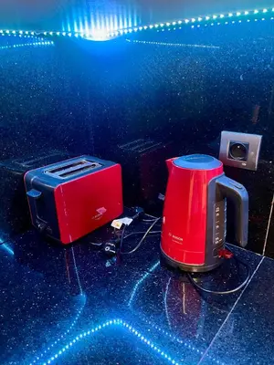 a red toaster sitting on top of a counter at Sea view apartment in Casablanca