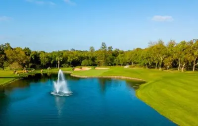 a fountain in a pond on a golf course at Appartement neuf luxe OLM à Rabat in Rabat