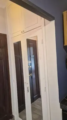 a mirror in a room with two doors at Welcome to km 0 of Casablanca in Casablanca