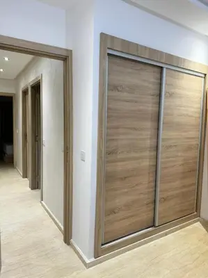 a room with two sliding doors on the wall at Nice appartement In Rabat-Temara in Temara