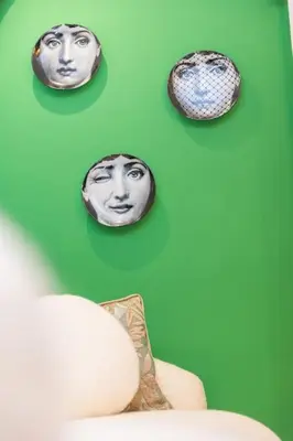 three pictures of faces on a green wall at So Chic & Lumineux Appartement Avec Terrasse Ensoleillée Au Coeur De Maarif Quartier Palmier Avec Parking Prés de Tramway Et Restaurants Luigi Casablanca in Casablanca