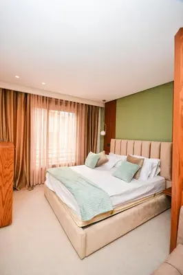 a bedroom with a large bed in a room at Studio 07 Maarif - High Speed Wi-Fi in Casablanca