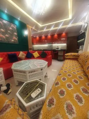 a living room with a bed and a couch at Grand et magnifique appartement in Casablanca