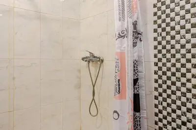 a shower with a shower head in a bathroom at Appartement avec terrasse en plein centre de ville in Casablanca