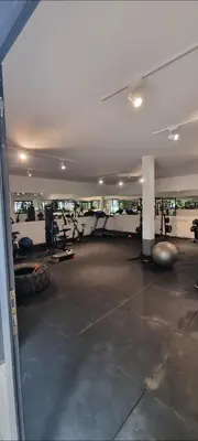 an empty room with a gym with tread machines at Cosy studio avec grande terasse et parking CFC in Casablanca