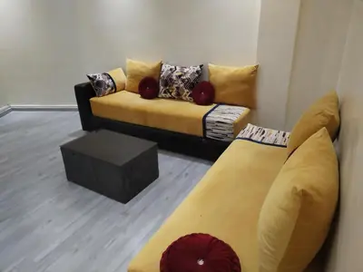a living room with a couch and a table at Sense housse in Rabat