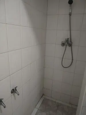 a bathroom with a shower with a shower head at Sense housse in Rabat