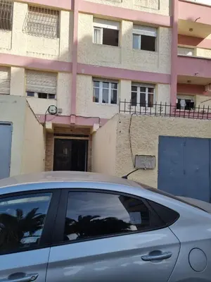 a car parked in front of a building at Sense housse in Rabat