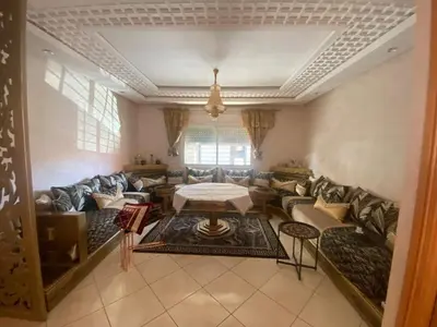 a living room with a couch and a table at Duplex in Casablanca