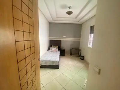 a bedroom with a bed in a room at Duplex in Casablanca