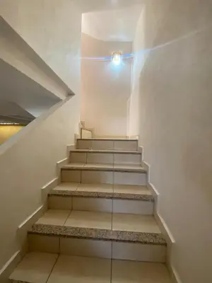 a staircase in a building with a light on it at Duplex in Casablanca