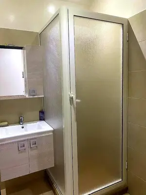 a bathroom with a shower and a sink at Salam Beach, El Mansouria in Pont Blondin