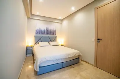 a bedroom with a large bed in a room at Studio au coeur de Casablanca in Casablanca