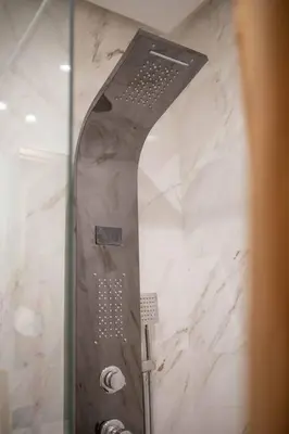 a shower with a glass door in a bathroom at Studio au coeur de Casablanca in Casablanca