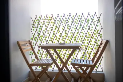 a table and two chairs in front of a window at Studio au coeur de Casablanca in Casablanca