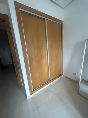 a room with a sliding glass door in a room at Salah in Bouznika