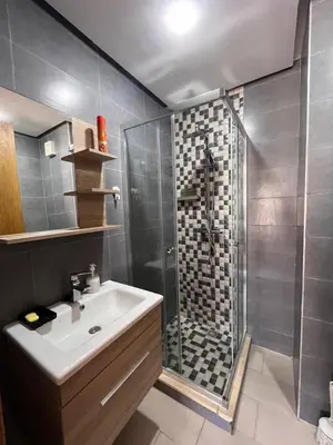 a bathroom with a sink and a shower at Salah in Bouznika