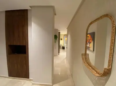 a bathroom with a mirror on the wall at Findy Maarif avec jardin privé in Maarif