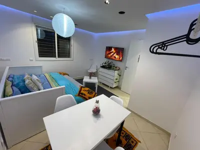 a living room with a bed and a table at Settat room Homy in Settat