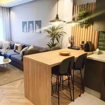 a kitchen and living room with a table and a couch at Downtown Luxury Stay CIL in Casablanca