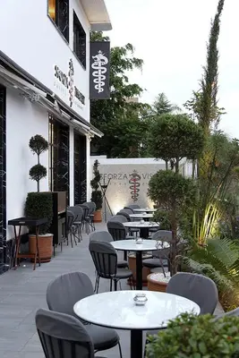 a group of tables and chairs sitting outside of a restaurant at Downtown Luxury Stay CIL in Casablanca