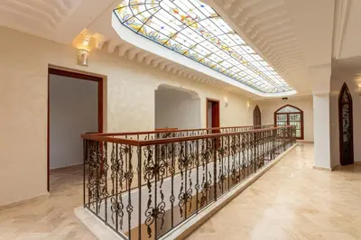 a large hallway with a skylight and a glass ceiling at Château Loriana in Bouznika