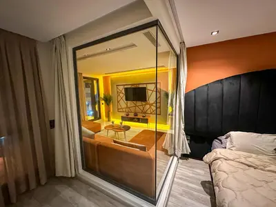 a bedroom with a large glass room with a bed at Cosy in Casablanca
