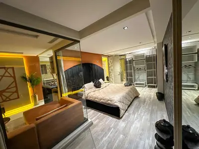 a bedroom with a bed and a couch at Cosy in Casablanca