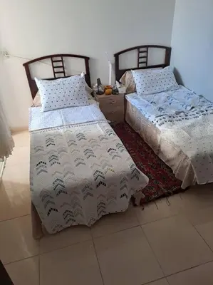 two beds sitting next to each other in a room at Moonskhirat in Skhirat