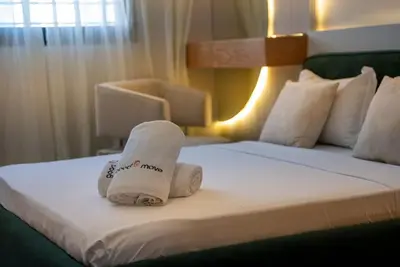 a pile of towels sitting on top of a bed at Sophisticated 3BR with Ample Space & Top Amenities in Rabat