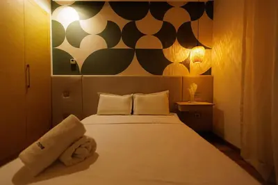 a bedroom with a large white bed in a room at Luxury 3BR Homelike Stay in Hay Riad in Rabat