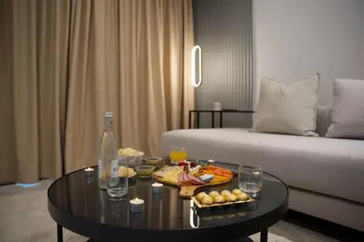 a living room with a coffee table and a couch at Fabuleux appart Casa port Marina in Casablanca