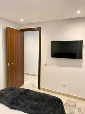 a bedroom with a flat screen tv on the wall at Casablanca in Casablanca