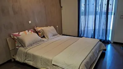 a large bed in a room with a large window at ANFA BLANCa in Casablanca