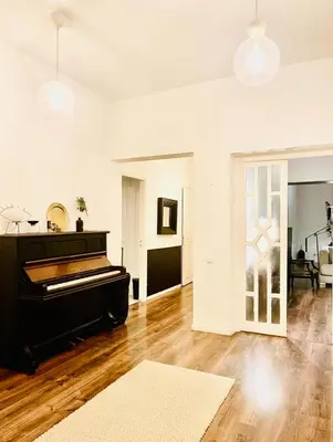 a living room with a piano in a room at Élégant Appartement 200m Au Coeur De Casablanca ! in Casablanca