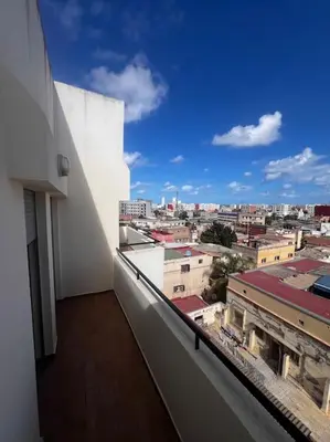 a balcony with a view of a city at Appartement de luxe à Casablanca in Aïn Sebaa