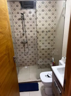 a bathroom with a shower and a toilet and a sink at Appartement de luxe à Casablanca in Aïn Sebaa