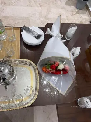a table with a plate of food in a plastic bag at Appartement de luxe à Casablanca in Aïn Sebaa