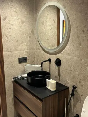 a bathroom with a sink and a mirror on a counter at Studio Anfa Living 1 in Casablanca