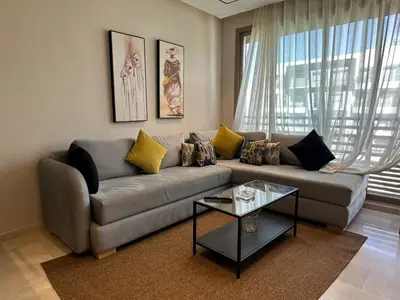 a living room with a couch and a table at Studio Anfa Living 1 in Casablanca