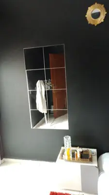 a mirror on a wall in a bathroom at émeraude house family in Casablanca