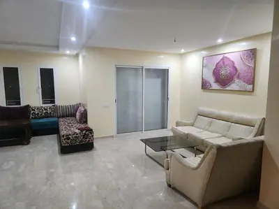 a living room with a couch and a table at Apartment Ocean View 2Br in Casablanca