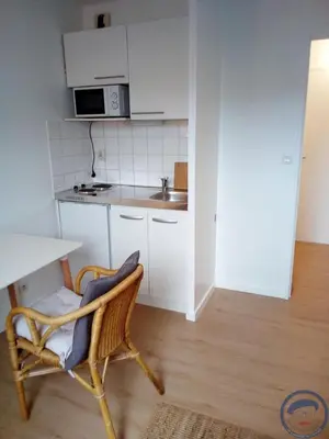 a small kitchen with a chair and a table at studio in Casablanca