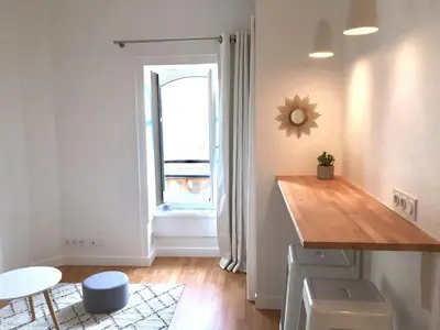 a kitchen with a wooden counter and a window at studio in Casablanca