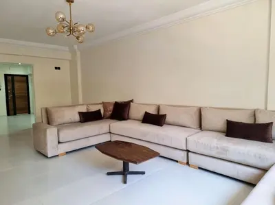 a living room with a couch and a coffee table at Appartement lumineux plein-centre, parfait pour explorer ! in Casablanca