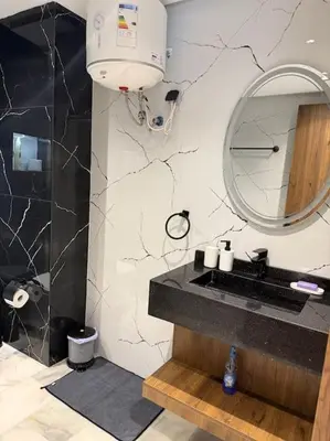 a bathroom with a sink and a mirror at Chic studio à Maarif, near CFC in Casablanca