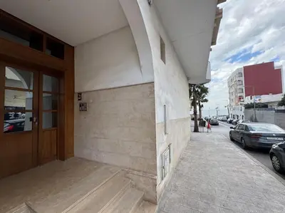 a building with a door on the side of a street at appartement exceptionnel vue sur mer pour famille uniquement in Rabat