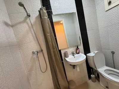 a bathroom with a shower and a toilet and a sink at appartement exceptionnel vue sur mer pour famille uniquement in Rabat