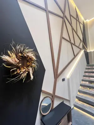 a room with a mirror and a plant on the wall at Quart des hôpitaux duplex luxe et sérénité in Casablanca